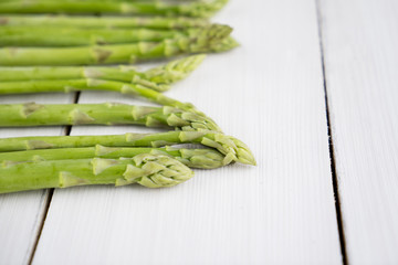 Fresh green sprout of asparagus on table