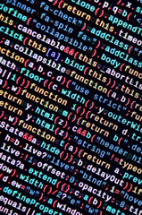 JavaScript code in text editor. Coding cyberspace concept. Screen of web developing code
