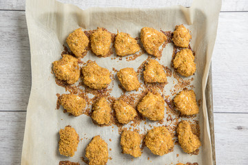 chicken nuggets baked on parchment