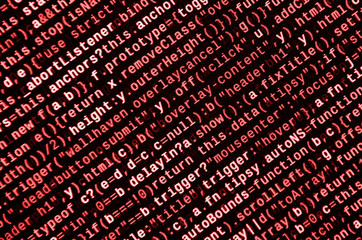 Writing programming code on laptop. Digital binary data on computer screen