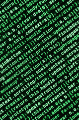 Writing programming code on laptop. Digital binary data on computer screen