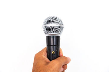 Microphone in hand on white background.