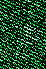 Writing programming code on laptop. Digital binary data on computer screen