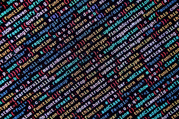 Writing programming code on laptop. Digital binary data on computer screen
