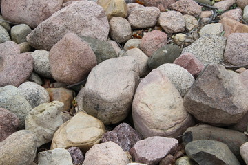rock with smiley face and other rocks