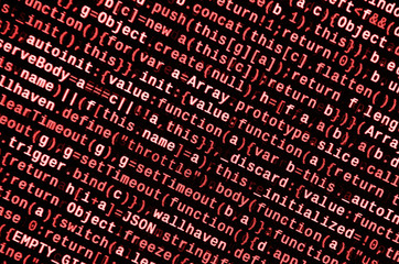 Writing programming code on laptop. Digital binary data on computer screen