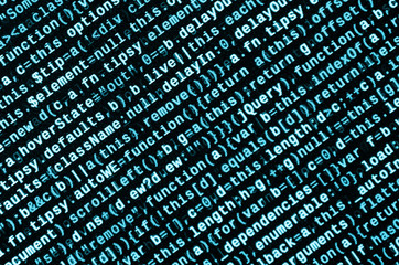 Big data and Internet of things trend. IT specialist workplace. Website HTML Code on the Laptop...