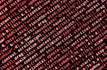 Writing programming code on laptop. Digital binary data on computer screen