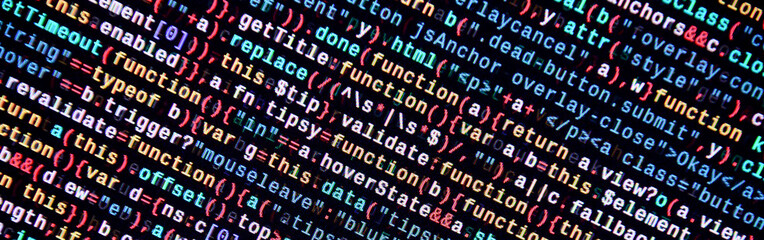 Writing programming code on laptop. Digital binary data on computer screen