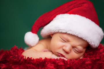 Christmas Newborn Baby Wearing Santa Hat and Sleeping