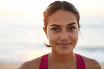 Portrait of young female athletic standing outdoors