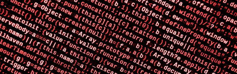 Writing programming code on laptop. Digital binary data on computer screen