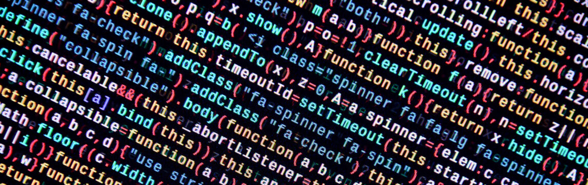 Writing programming code on laptop. Digital binary data on computer screen