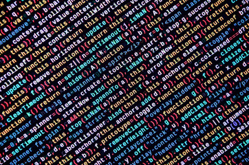 Writing programming code on laptop. Digital binary data on computer screen