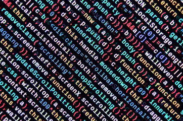 Writing programming code on laptop. Digital binary data on computer screen