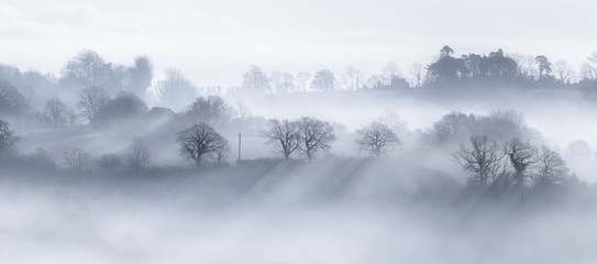 Misty morning fog across rural valleys in UK