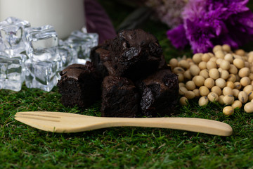 stack of chocolate brownies with raisins seed 
