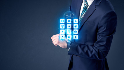 Businessman wearing smartwatch with application icons.