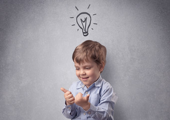 Smart little junior in front of a drawn up grey wall with childlike concept