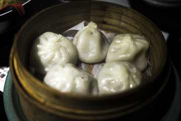 wooden bowl full of fresh dumplings