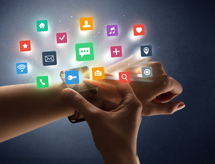 Naked female hand with smartwatch and  application labels around and dark background