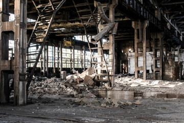 Fototapeta premium Abandoned ruined building of an old factory house broken walls non-residential premises for design background