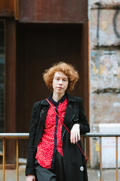 Portrait of young woman in city street