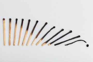 Matches forming falling sequence on slightly gray background