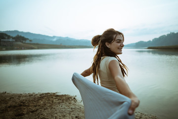 portrait caucasian women raise arm with blangket relax side the 