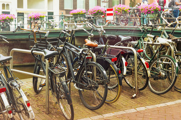 Different bicycles in the historical center of Amsterdam, Netherlands.