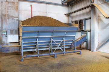 Granules of rape cakes in the agricultural factory for the production of rapeseed oil.
