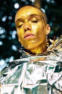 Face art by gold glitter