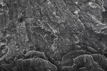 Black granite stone rough texture background