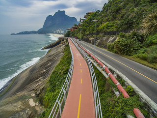 Highway by the sea. Wonderful road and bike path. Bicycle and road track and next to the blue sea...