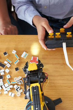 Young boy with a robot remote control