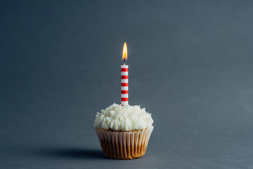 Birthday cupcake on a charcoal background