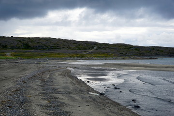 Low skies over Varanger Fjord bay of the Barents sea in summer.