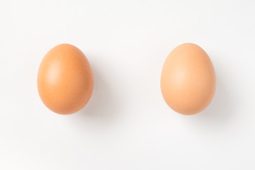 Couple brown chicken egg on white background