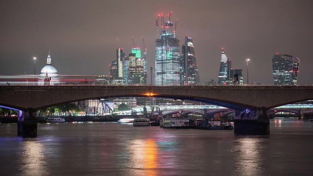 Time-lapse of traffic on Waterloo Bridge and London skyline in the background.