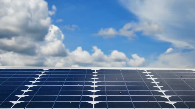 Technology Video Solar panels are used to produce clean electricity environmentally friendly with the sky background. In green technology and renewable energy ideas.