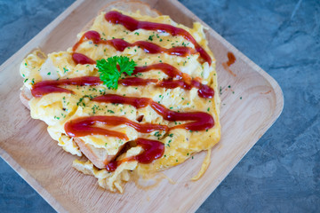 Scrambled eggs with ketchup on toasted