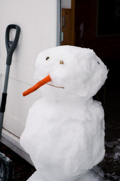 Doorman. snowman by front door.