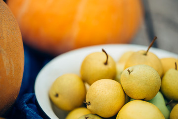 Close up of beautiful fresh pears on the background of autumn harvest