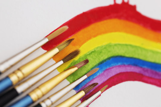 Watercolored rainbow swirl and brushes