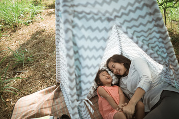 camping of mother and a daughter in the nature