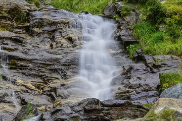 Waterfall in the forest in Austria near Heiligenblut am Großglockner
