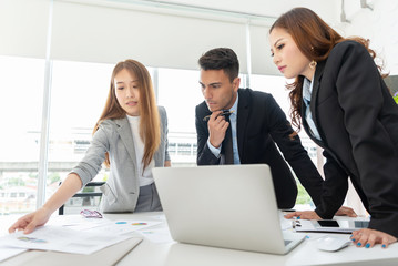 Fototapeta premium Young Business People are discussing and brainstorming together.