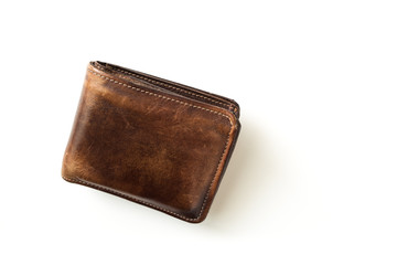 Top view hand made old leather wallet isolated on white background