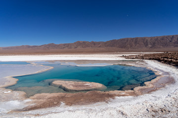 lagunas de baltinache - lake surrounded by salt in the middle of the atacama desert