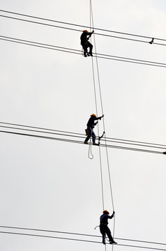 Electrician Worker Of Metropolitan Electricity Authority Working Repair Electrical System On Electricity Pillar Or Utility Pole